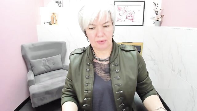 Carmensoft mature white-haired MILF in sexy green military jacket on webcam