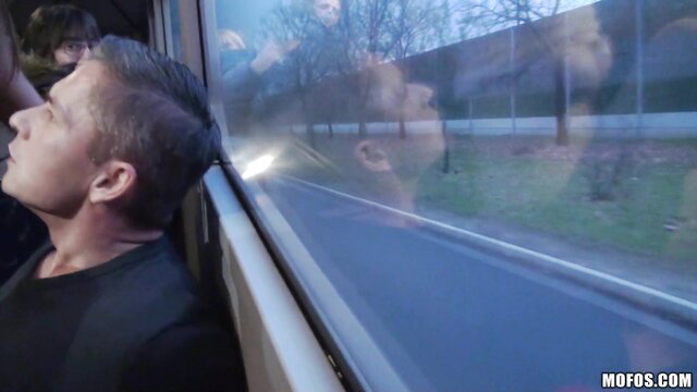 Bonnie Shai on train gazing out window, hot amateur public tease