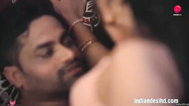 Indian couple in close embrace, bangles on arm, homemade sex tease