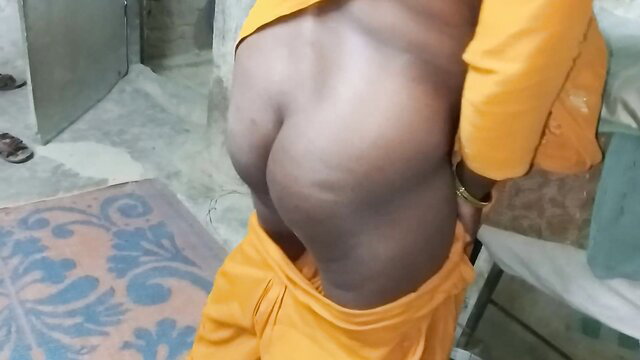 Desi man in yellow robe bent over exposing big brown ass cheeks