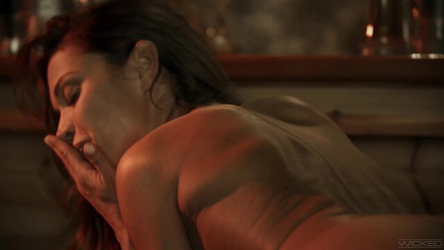 Alyssa Reece nude and sensual in a dimly lit setting