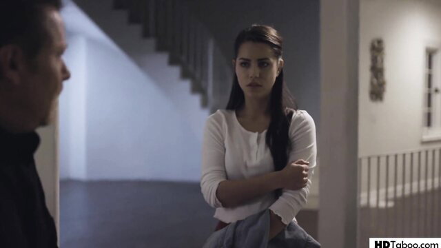 Alina Lopez in white top arms crossed tense indoor scene