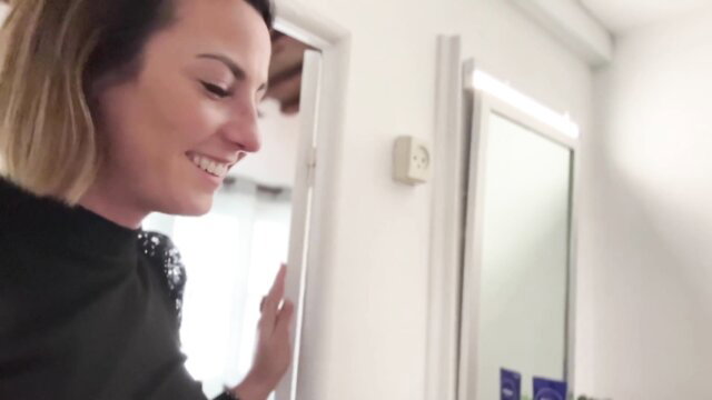 Smiling French amateur Pam in black top by mirror, soft tease