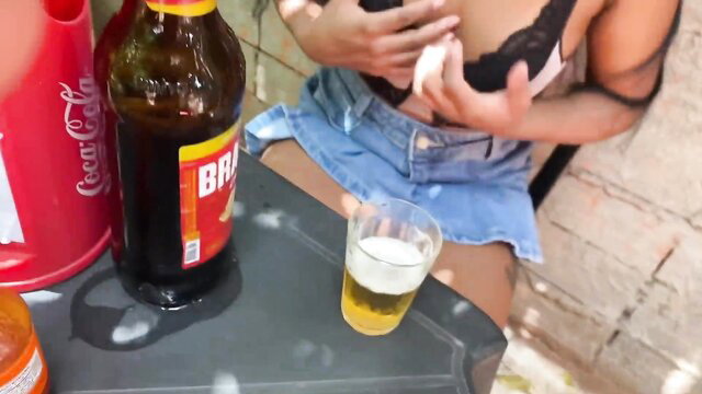 Brenohot teases tits in black lace bra outdoors with beer