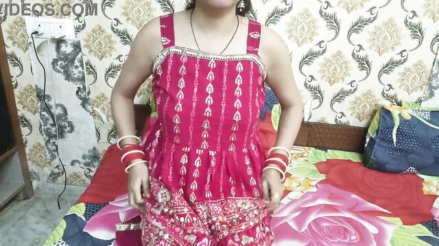 Hot Indian bhabhi in red lehenga choli with bangles on bed