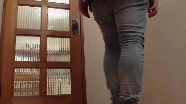 Masochist woman in tight gray jeans stands by door, Hisidepon JAV deep throat tease