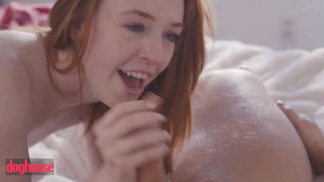 Madi Collins nude on bed smiling, sucking cock closeup