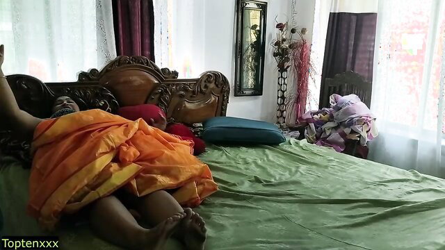 Curvy Indian MILF in orange saree on bed, hot Hindi XXX web series
