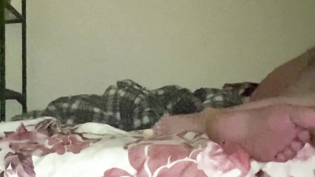 TCrazyGirl2010's bare Asian soles and ass on bed in hardcore vid