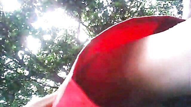 Upskirt view spying on wife's aunt's sweet pussy and ass in red skirt outdoors