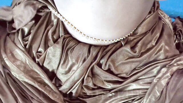 Desi Aunty Cougar in draped silk gown with pearl necklace closeup