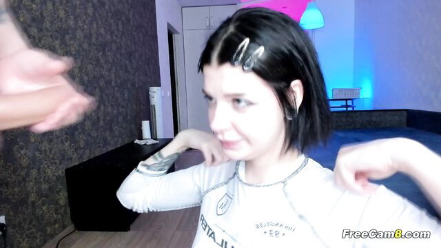 Brunette amateur poses topless in white sweater on cam