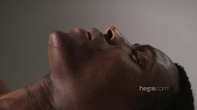 Closeup of handsome black man's face in ecstasy, orgasmic delight