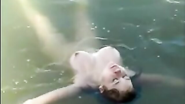 Hot GF floats nude in public pool, wet tits and body exposed