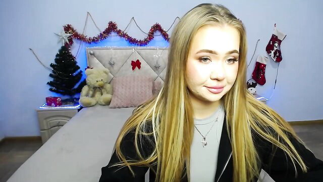 Blonde StacyYellig teases in black jacket on Christmas webcam