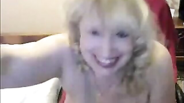Busty Russian mommy teases on webcam with massive knockers