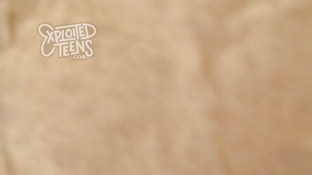 Exploited Teens logo on blurred beige background