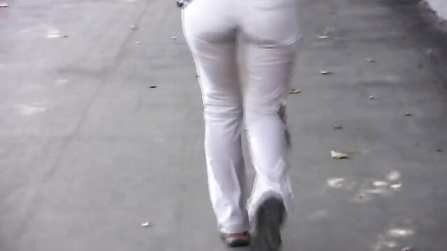 Russian babe in tight white pants walking, big ass view from behind