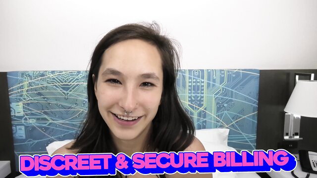 Asian beauty smiles in bed for discreet secure billing ad