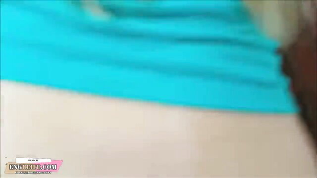 Amateur blonde lifts teal top flashing big tits at train station parking