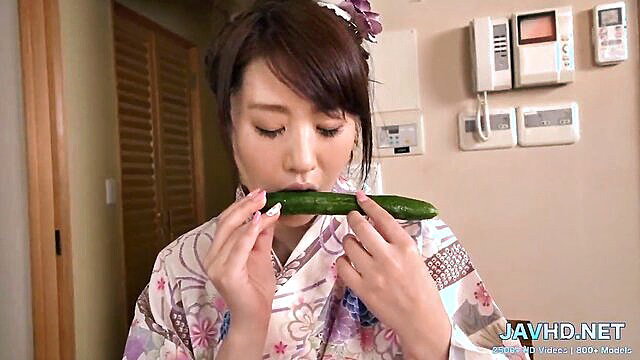 Japanese milf in kimono sucking cucumber seductively