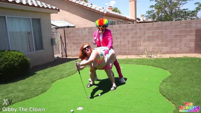 Julie Ginger rides Gibby The Clown doggystyle on mini golf green