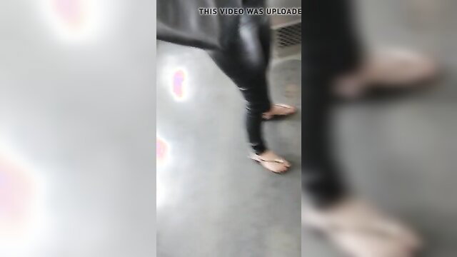 Sexy mature Brazilian MILF in shiny black leggings and flip flops