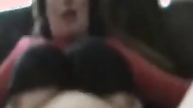 Busty brunette with huge black bra cleavage in car amateur tease