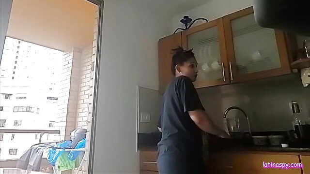 Latina maid Milena washing dishes in tight shirt and shorts