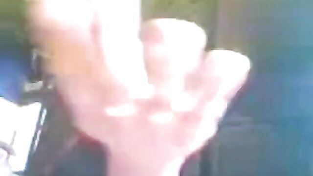 Blurry closeup of woman's pale hand gripping thick veiny cock in amateur outdoor fuck