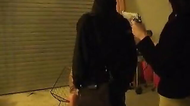 Two hooded figures with gun in tense garage standoff, Lethal Lipstick