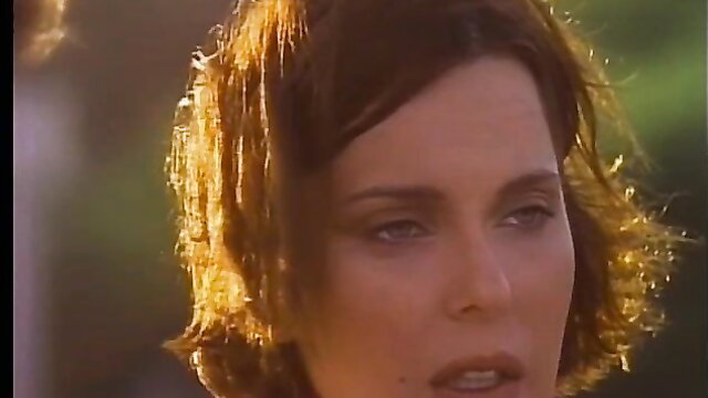 Closeup of sexy brunette retro pornstar with sultry gaze, 1993 classic
