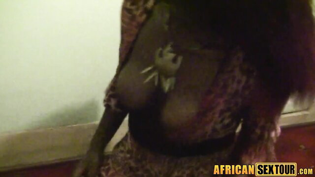 Ebony MILF in leopard lingerie with spider tattoo on big tits