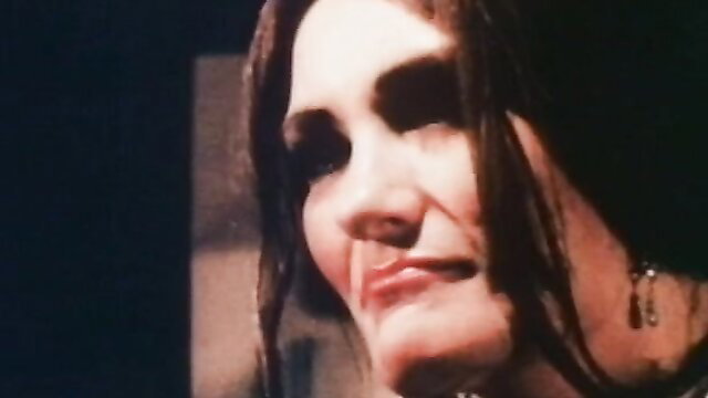 Brunette with intense gaze in Devil’s Ecstasy 1976 vintage porn thumbnail