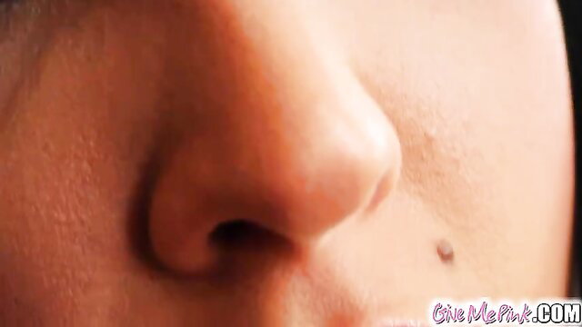 Slim Asian babe closeup nose piercing solo masturbation