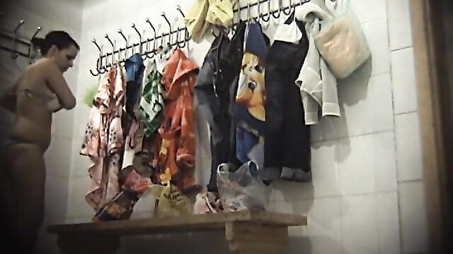 Gorgeous college girl nude undressing in locker room voyeur cam