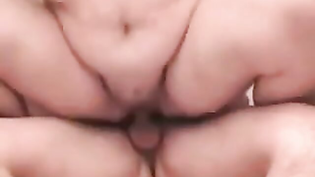 Closeup of mature woman's shaved pussy spread wide in explicit pose