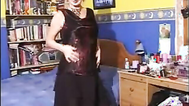 Busty blonde in sheer black dress dances seductively solo