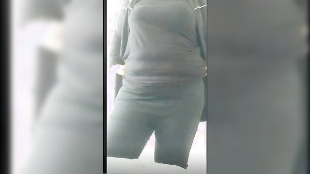 Turbanli Turkish woman in tight gray shorts and hoodie, thick thighs upskirt tease