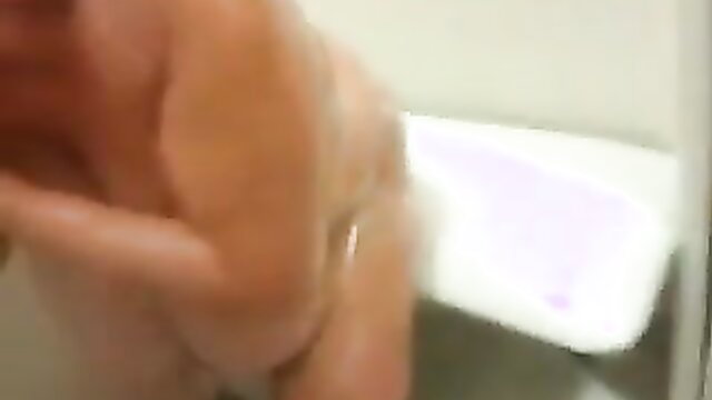 Mature BBW mom in bathroom showing huge wet tits