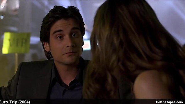 Michelle Trachtenberg topless with man in dark suit, intimate scene