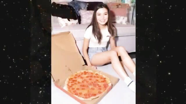 Cute young Latina iCarly lookalike in tiny shorts eating pizza solo