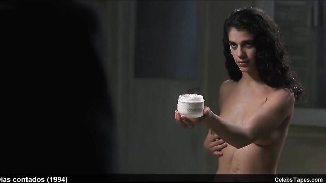 Nude Candela Pena holding cream jar in sexy scene