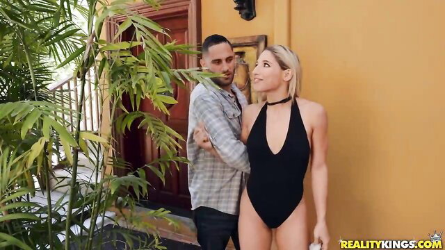 Abella Danger in black slingshot bikini outdoors with man Reality Kings