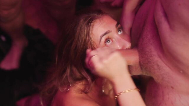 Lily Phillips close-up face in 40-man bukkake, eyes wide, hand on cock