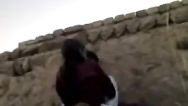 Iranian Baluch woman sneaky outdoor fuck on ancient stone wall