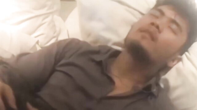 Indonesian man asleep on bed in semi-Indo adult film thumbnail