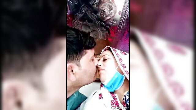 Desi Indian couple kissing passionately in truck