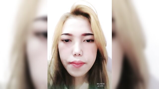 Blonde Asian amateur babe with sharp features in blurry closeup selfie