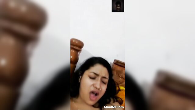 Indian woman deepthroating cock on bed in amateur blowjob